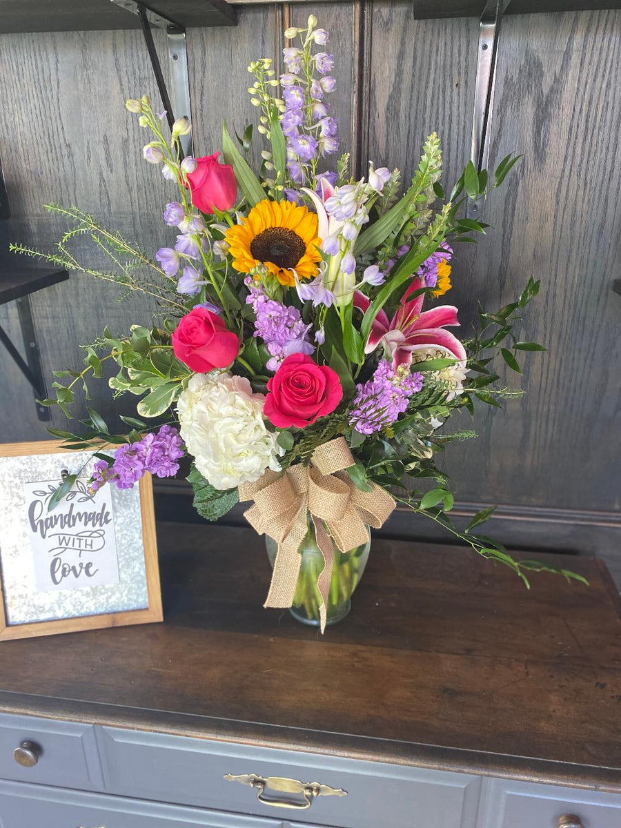 Rancho Cucamonga Flowers Florist Arrangement with sunflowers, hydrangea, roses, stock, stargazer Lilly, delphinium.